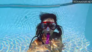 European Teen Enjoys Solo Toy Play Underwater