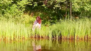 Redhead Beauty Strips Naked by the Lakeside