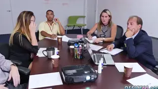 Three Students Share Desk in Classroom