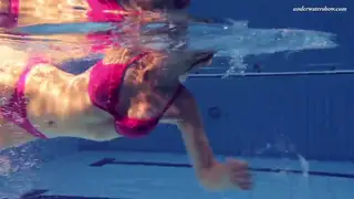 Woman in Stockings Spreads Legs Underwater at Poolside
