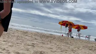 Busty MILF Delivers a Public Blowjob on a Sunny Beach