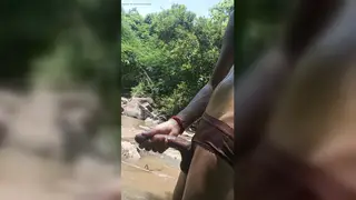 Indian Teen Strokes His Muscular Cock in a Public Stream