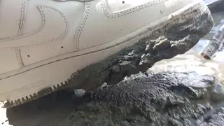 Slim Man Tramples Muddy Sneakers Sockless