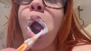 Redhead Teen Demonstrates Oral Routine with Toothbrush