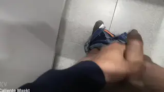 Hands Reach Through a Bathroom Wall to Grab a Cock