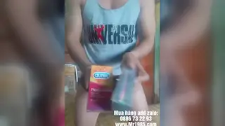 Asian Solo Demonstrates Condom Use During Outdoor Gym Session