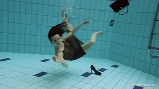 Busty Teen Shows Off Her Curves During Nude Pool Swim