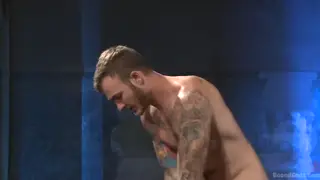 Tattooed Sub Endures Bondage and Spanking Before Cumshot