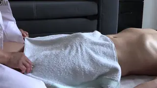 Asian Masseuse Delivers Oiled Handjob to Explosive Cumshot