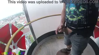 Uncut Guy Jerks Off in Glass Elevator Thirteen Floors Up