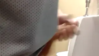 Hairy Bear Releases Massive Load at Public Urinal