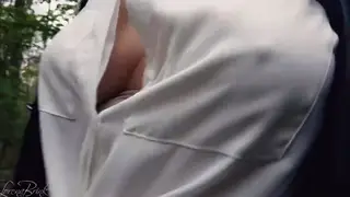 Busty Woman Flaunts Curves in Blouse and Leather Jacket