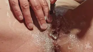 Tattooed MILF Shaves Hairy Pussy in Bathroom