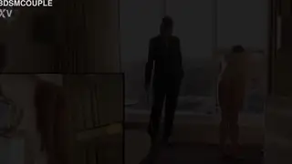 Dominant Woman Administers Caning by Open Window