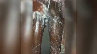 Ebony Teen Strokes His Cock Under the Shower Spray