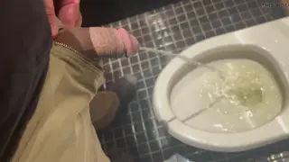 Hairy Bear Releases a Steady Stream at the Urinal