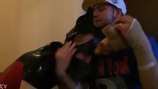 Rubber Puppy Play Unfolds in a Public Hallway