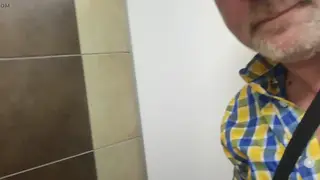 Uncut Cock Drains Through Public Gloryhole Outdoors