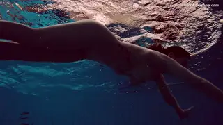 Busty European Brunette Teases Poolside in Tiny Bikini