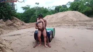 Voluptuous Couple Embraces Rain-Soaked Interracial Passion