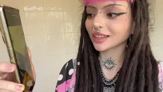 Tattooed Pierced Teen Stares Down Lens While Masturbating