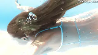 Blonde Teen Glides Through Crystal Water in Nude Swim