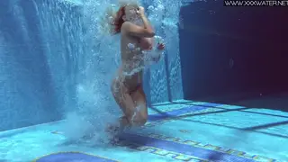 Blonde Petite Babe Teases Hairy Pussy in Outdoor Pool