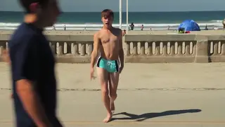 Muscular Twink Flaunts Speedo Bulge On Beach