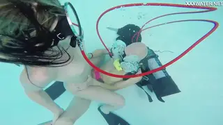 Busty Woman Gives Underwater Blowjob and Handjob in Pool