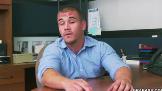 Three Suited Men Share a Desk in an Office Threesome