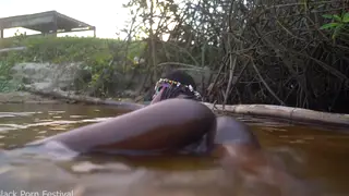 Petite Ebony Lesbians Share Intimate Pussy Licking in Water