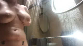 Busty Blonde Soaps Up Curves Under Steamy Water
