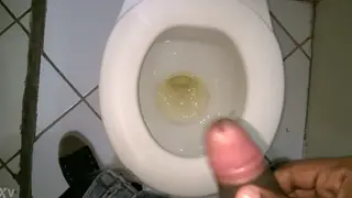 Hairy Latino Pisses in a Bathroom Stall