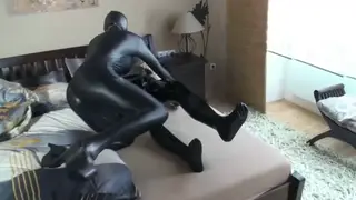 Busty MILF Writhes in Shiny Black Bodysuit