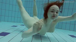 European Teen Strips and Swims Naked in Outdoor Pool POV