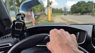 Redhead Enjoys Risky Outdoor Play Near a Bus Stop