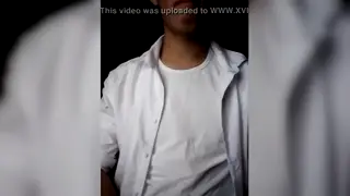 Student in Uniform Touches Himself at a Desk