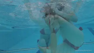 Petite Redhead Strips in Pool for Solo Tease