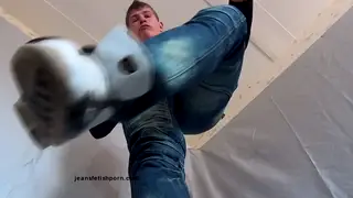Jeans-Clad Feet Worshipped in Trampling Fetish Clip