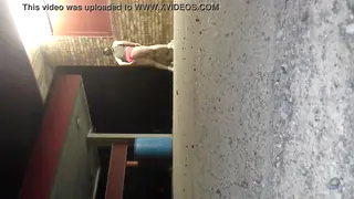 Femboy Teases in Pink Boyshorts Outside Adult Store