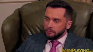 Suited Executive Takes His Colleague Over the Desk