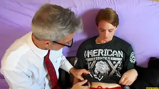Stepdad Gives Stepson Oral Pleasure in Fetish Scene