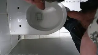 Slim Femboy Drenched in Piss During Public Gloryhole Orgy