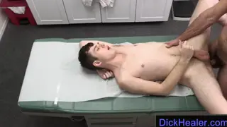 Mature Doctor Barebacks a Young Patient on an Exam Table