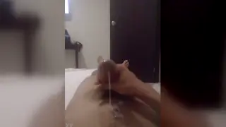 Latino Guy Strokes His Cock in a Hotel Room