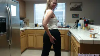 Voluptuous Mature Woman Flaunts Curves in Kitchen