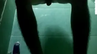 Asian Guy Strokes His Cock in Bathroom Mirror