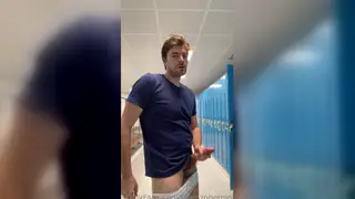 Muscular Jock Strokes His Uncut Cock in the Gym Showers