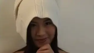 Asian Babe Teases with a Slow Strip on Cam