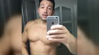 Muscular Jock Flexes and Pumps Iron in Empty Gym